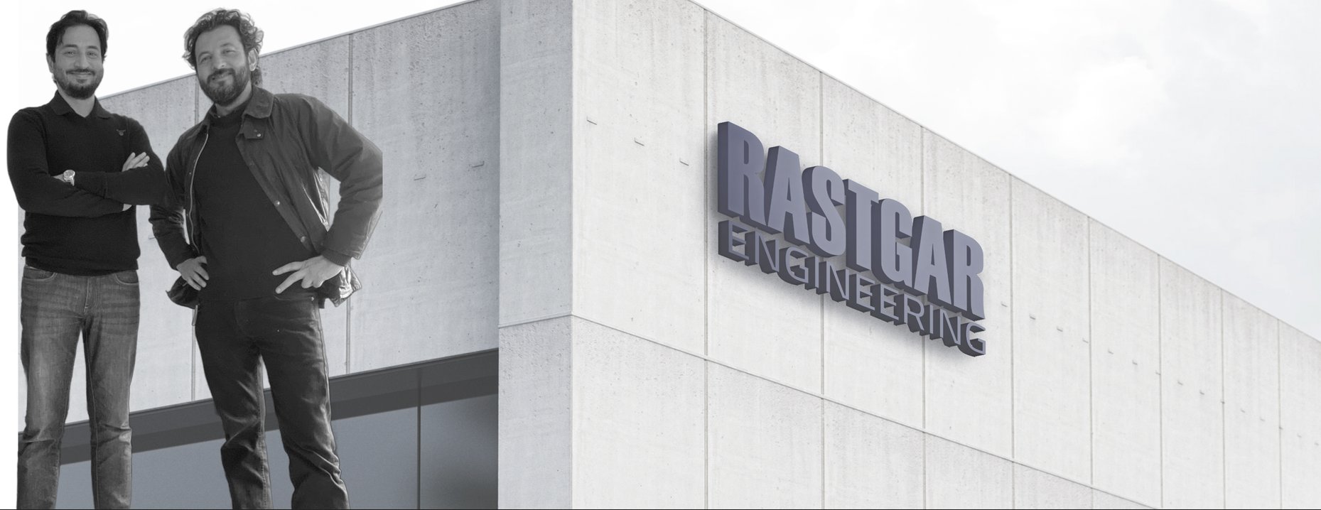 Two colleagues standing outside the Rastgar Engineering building